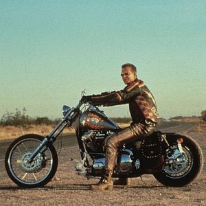 Photo Harley Davidson et l'homme aux santiags