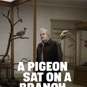 Photo Un pigeon perché sur une branche philosophait sur l’existence