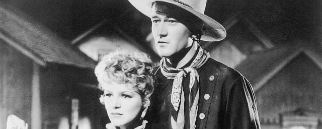 John Wayne e Claire Trevor em “Passeio Fantástico” (1939)